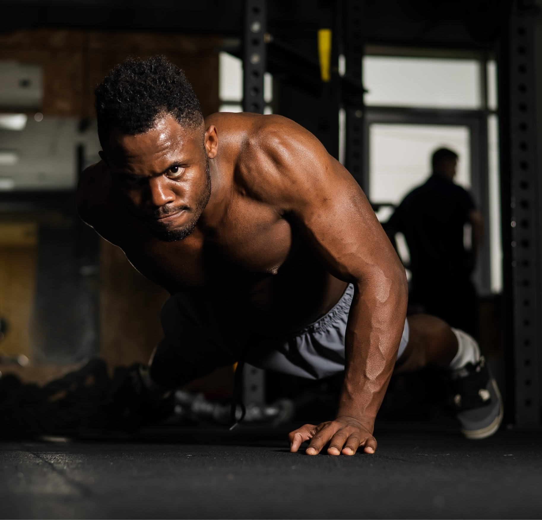 Man doing  pushups in a gym