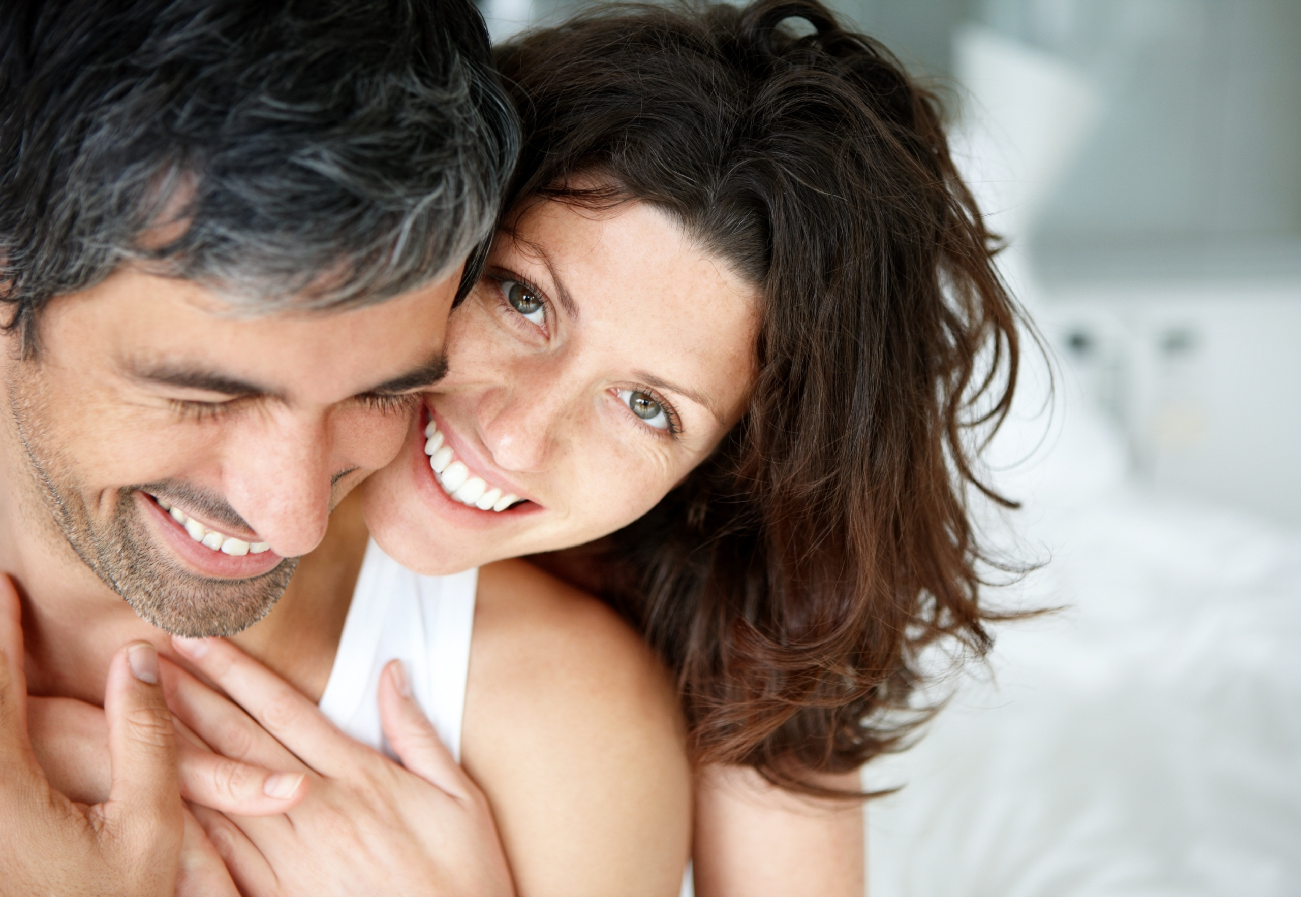 Close-up of a happy, healthy couple who represent health optimization