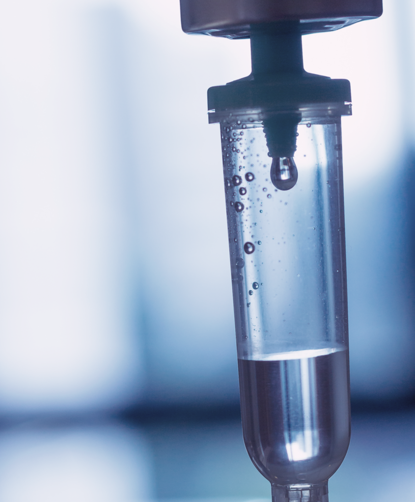 IV drip chamber in blue, showing IV Therapy at Lifespan Health